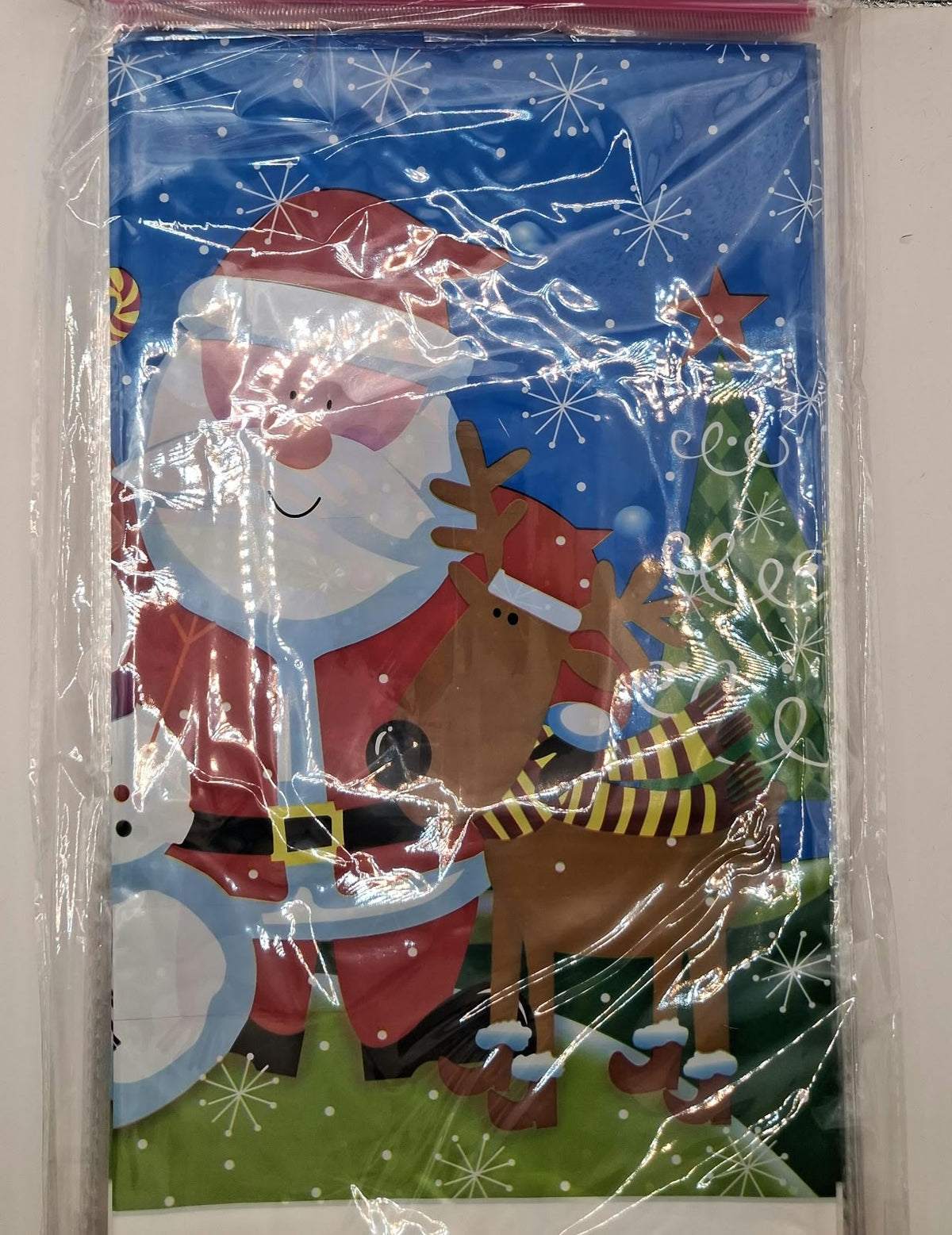 Blue Christmas table cover with Santa, reindeer, snowman and Christmas tree